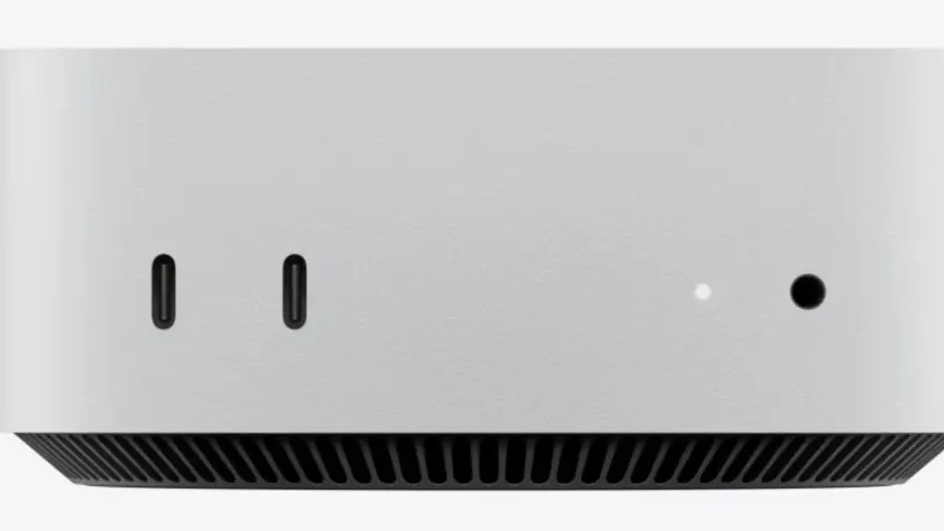 Vorderseite des neuen Apple Mac mini mit zwei USB-C-Anschlüssen und Kopfhörerbuchse.